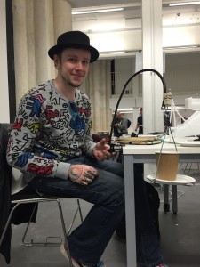 Adam created a swinging, stabilising cup and flute-like glass holder so wheelchair users can drink in social events with out being restricted in mobility.